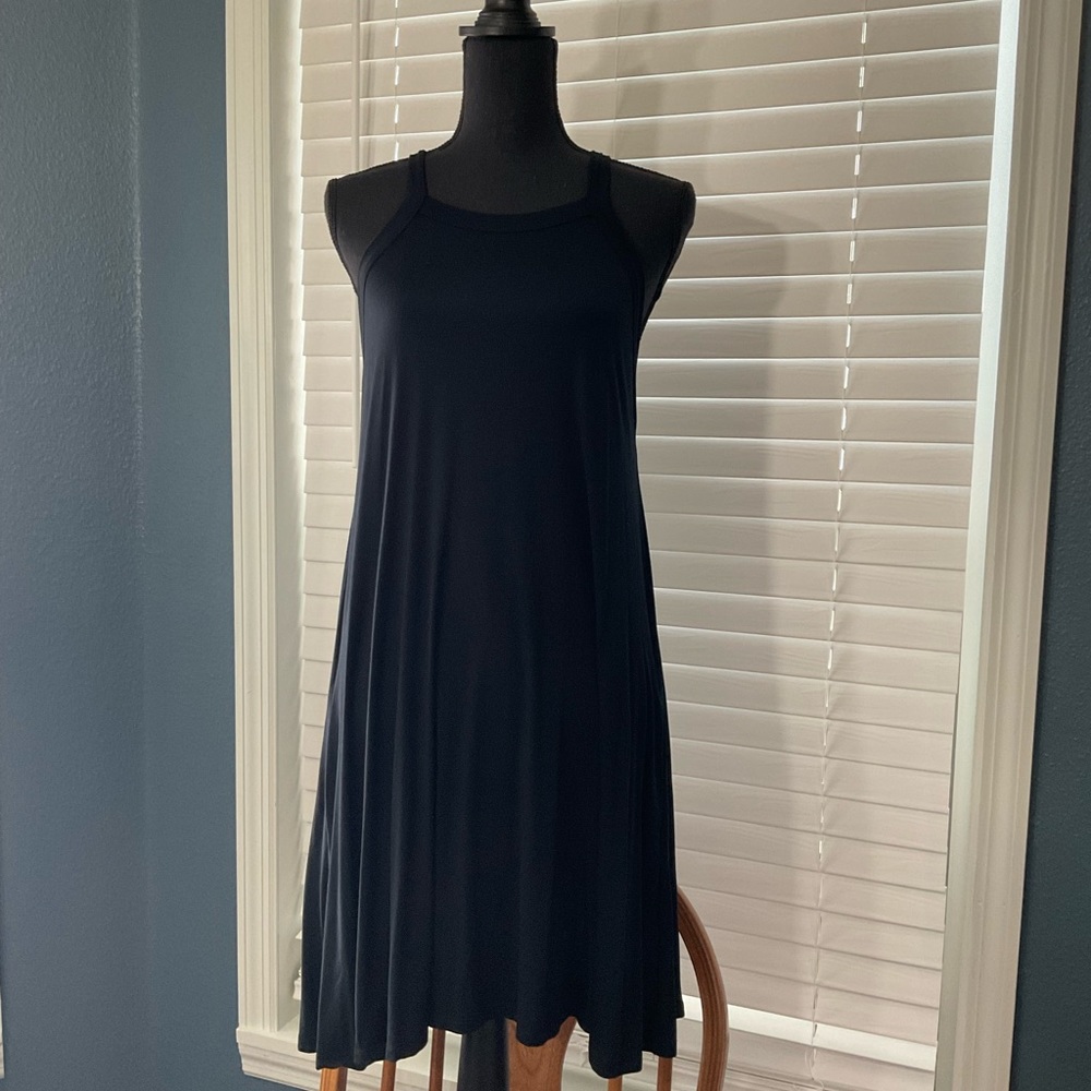 Black T-shirt, material summer dress or swimsuit cover up.